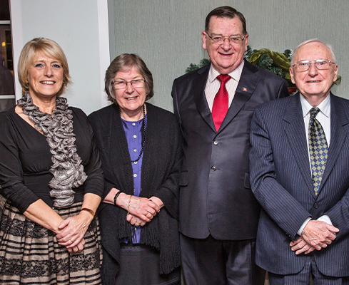 Group photo of Maggie Dawson, Lady and Lord Griffiths (WEA Llanelli President), and Ken Owen